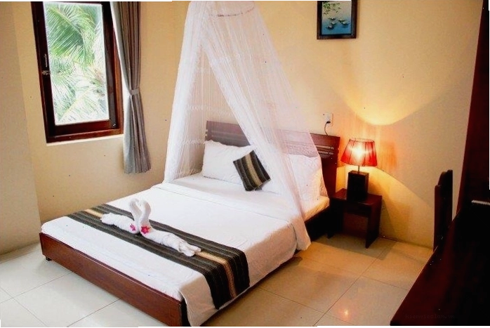 Phòng ngủ 2 người tại Sóng Biển Xanh Resort với thiết kế ấm cúng